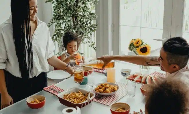 woman in white shirt holding a girl in white shirt